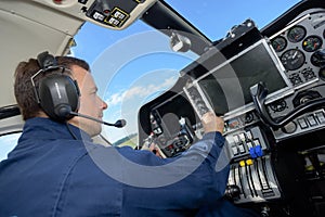 Pilot taking off in airplane cockpit