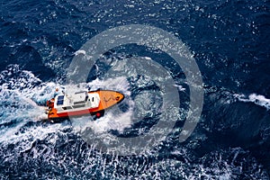 Pilots boat aerial view sailing in blue ocean