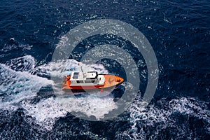 Pilots boat aerial view sailing in blue ocean