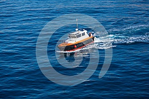 Pilots boat aerial view sailing in blue ocean