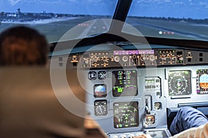 Pilots in a cockpit of an airplane