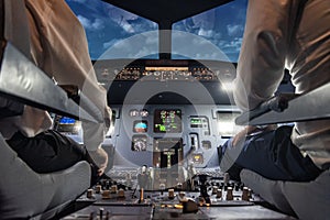 Pilots in a cockpit of an airplane