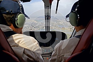 Pilots in helicopter cabin