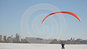 Pilots of the paraglider landed on a frozen lake near the city park