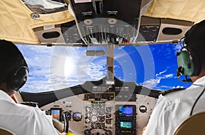 Pilots in the plane cockpit and sky