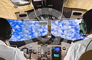 Pilots in the plane cockpit and sky