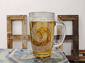 Pilsener beer in a dimpled mug