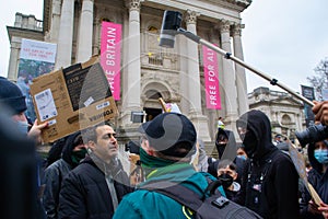 PIMLICO, LONDON - 11 February 2023: People harassing a livestreamer whilst protesting in support of Drag Queen Story Hour at Tate