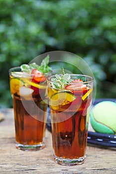Pimms in the garden with tennis racket