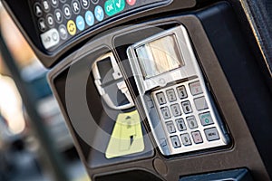 PIN pad on parking meter in city