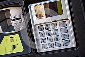 PIN pad on parking meter in city