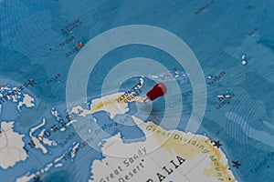 A pin on port moresby, papua new guinea in the world map