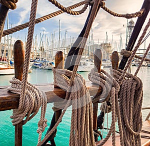 Pin rail with fixed ropes. An old sailing ship