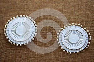 Pin set for sewing on dark canvas texture background