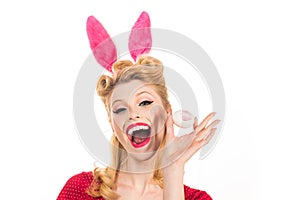 Pin-up Bunny. Beautiful blonde girl with bunny ears and Easter egg. Easter Cards. Pin up Easter. Bunny ears concept