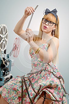 pin-up with a film reel and cinema projector