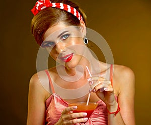 Pin up girl drink bloody Mary cocktail. Pin-up retro female style.