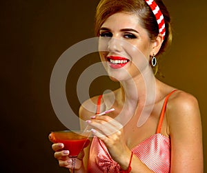 Pin up girl drink bloody Mary cocktail. Pin-up retro female style.