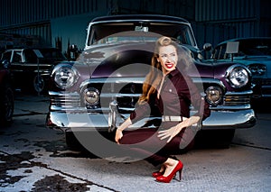 Pin-up girl in retro car