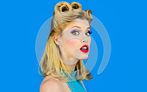 Pin-up girl with trendy makeup. Pinup Woman with fashion hair. Pretty girl in vintage style. Retro fashion.