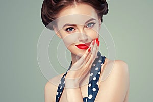 Pin up girl vintage. Beautiful woman pinup style portrait in retro dress and makeup, manicure nails hands, red lipstick and polka