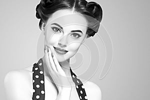 Pin up girl vintage. Beautiful woman pinup style portrait in retro dress and makeup, manicure nails hands, red lipstick and polka