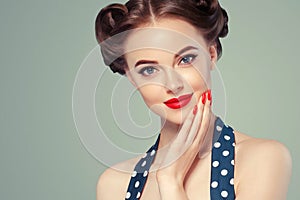 Pin up girl vintage. Beautiful woman pinup style portrait in retro dress and makeup, manicure nails hands, red lipstick and polka