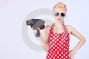 Pin-up girl with vintage camera photo