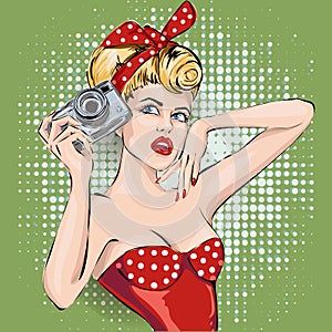 Pin-up woman with camera taking pictures