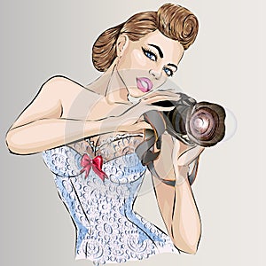 Pin-up woman with camera taking pictures