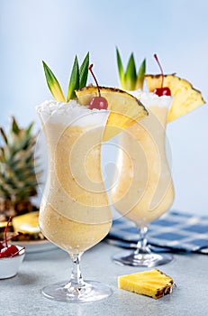 Pina colada cocktail with cherry and pineapple