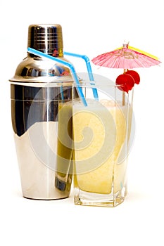 Pina colada cocktail with umbrella & shaker