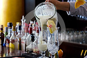 Pina Colada, exotic Cocktail ready to serve and is poured into a glass