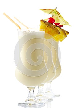 Pina colada summer drinks with piece of pineapple isolated on white