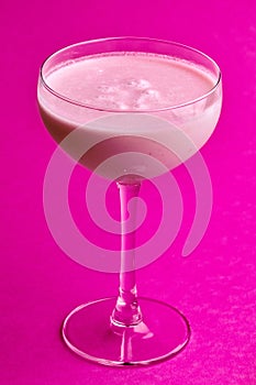 Pina Colada - Tropical Cocktail with Kahlua, Coconut Milk and Rum. Fresh Summer Drink on purple background