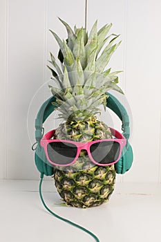 Pinapple with sunglasses and headphones