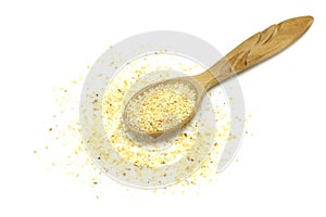 Pinch granulated garlic in a wooden spoon