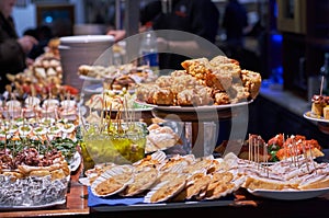 Pinchos and tapas typical of the Basque Country, Spain. Selection of different types of foods to choose from. San Sebastian