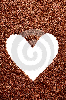 Pine bark mulch surrounding white heart symbol