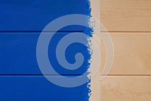 Pine boards painted in blue color and sticky tape