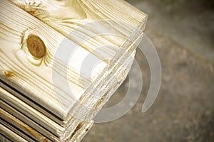 Pine boards stacked in a hardware store. Construction material