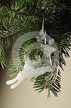 Pine branch with reindeer bauble, close up