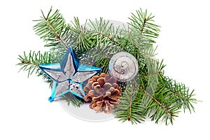 Pine cone with bauble and evergreen branch on a white background
