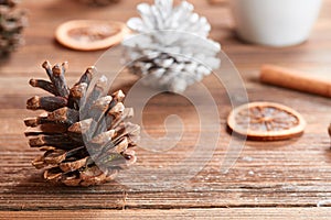 Pine cone brown and white on wooden table