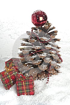 Pine cone Christmas tree and cinnamon sticks.