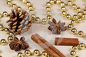 Pine cones, cinnamon sticks, star anise and pearl tinsel