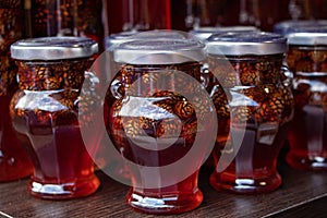 Pine cones in honey. Glass jars of pine cone jam