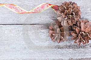 Pine Cones and red ribbon