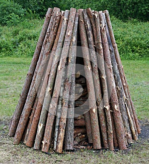 Pine logs are put in a pyramid for a traditional ritual pagan fire.