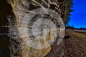 Pine river rock formation base  along the half mile long, pine topped sandstone little rock at pier park in rockbridge wi photo